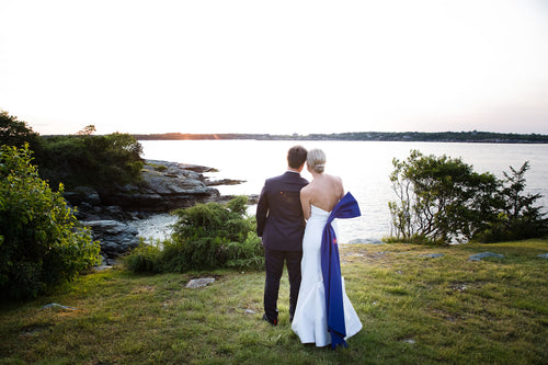 This Bride Wore A Carolina Herrera Dress with a Dramatic Blue Sash to Her Wedding at the Iconic Castle Hill Inn