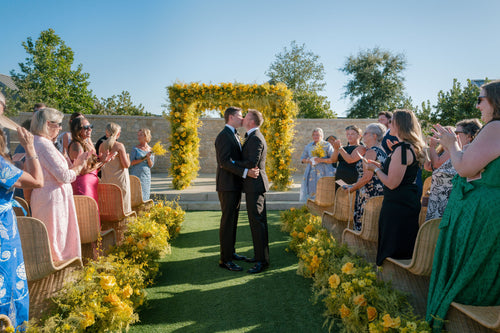 Yellow Blooms Surrounded These Grooms as They Exchanged Vows at Stanly Ranch