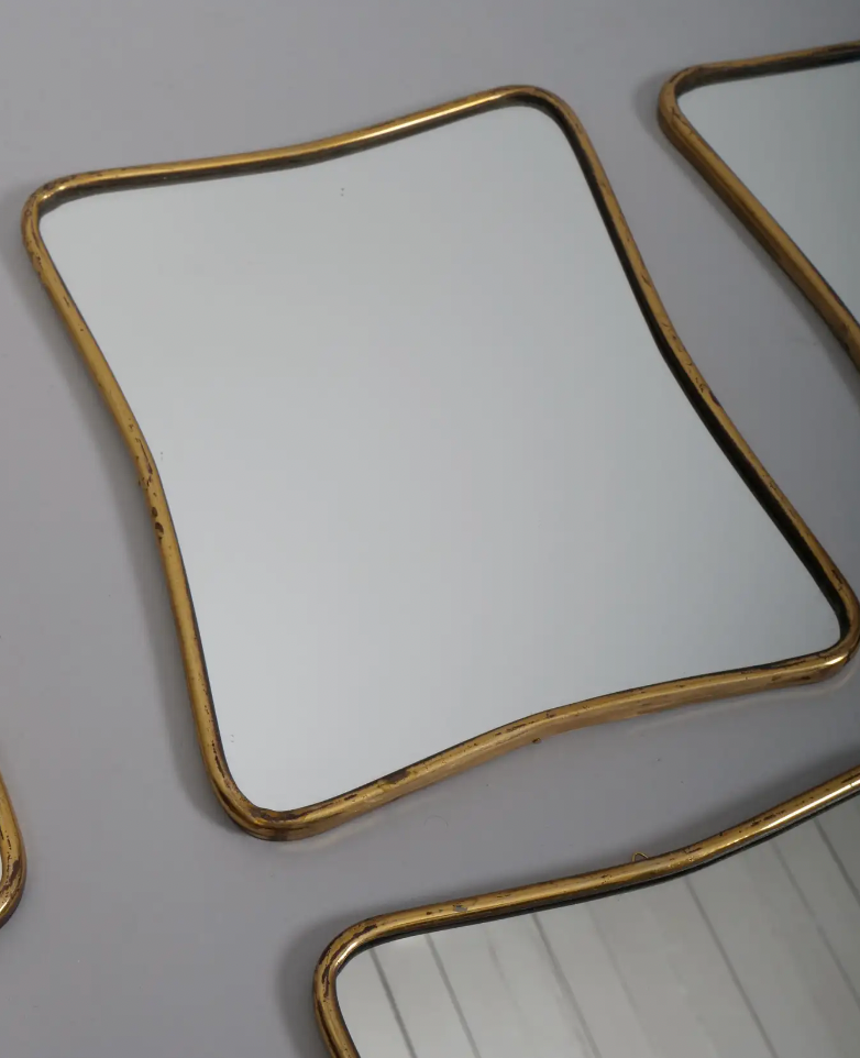 Small Brass frame Gio Ponti style mirrors. Italy c1950