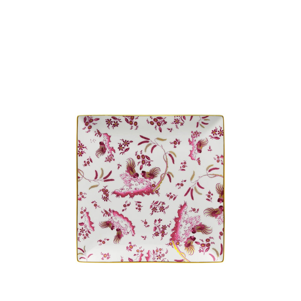Top view of Oro Di Doccia medium vide poche squared plate showing pink rooster and floral pattern on white porcelain with gold rim