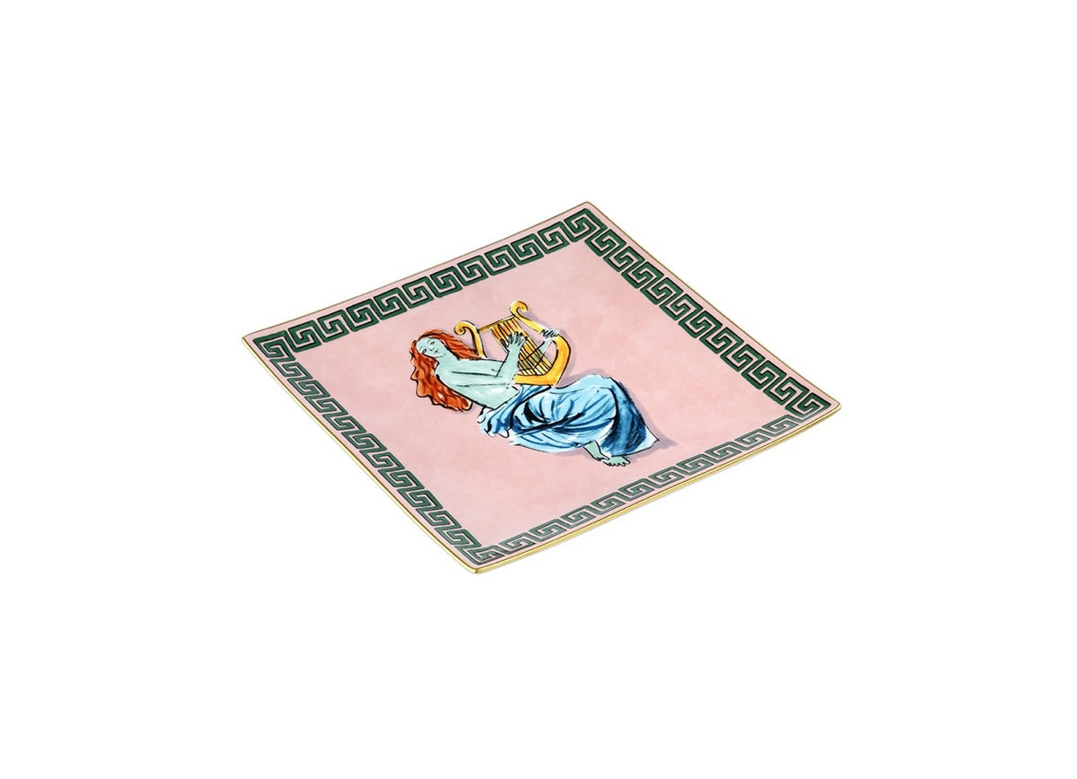 Angled view of Il Viaggio Di Nettuno vide-poche, pink porcelain square tray with green Greek-key border and central figure