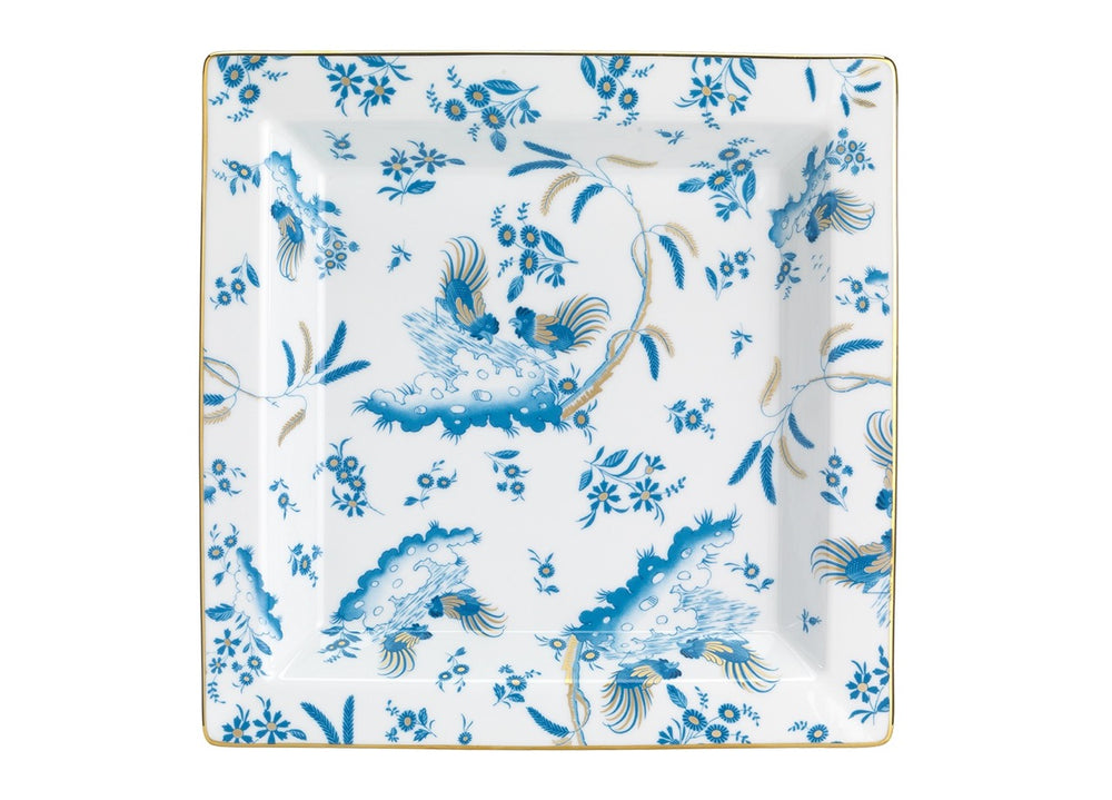 Top view of Oro Di Doccia large squared vide poche with blue floral and rooster pattern and gold rim on white porcelain