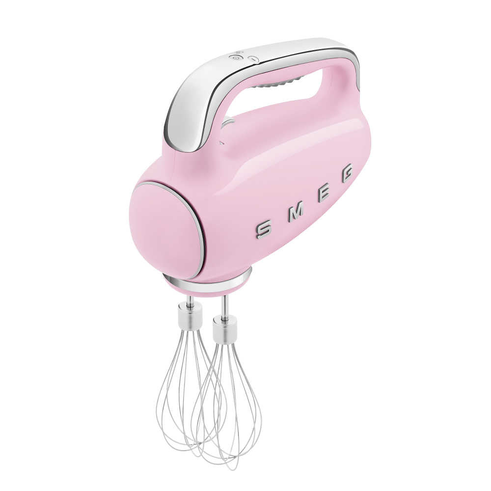 Three-quarter view of pink SMEG hand mixer with two wire whisks on white background