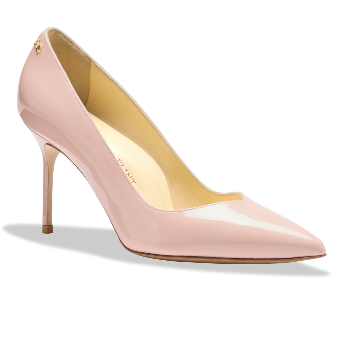 Side view of Perfect Pump 85 in Petal Patent showcasing glossy light pink patent leather, pointed toe, and slim heel on white background