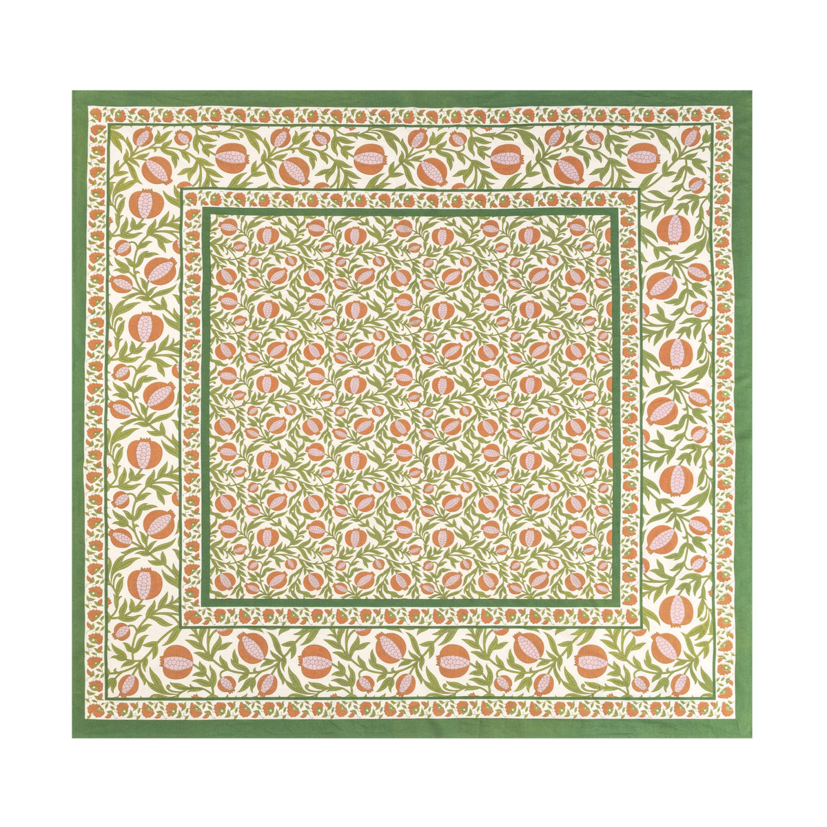 Close-up of French Tablecloth Grenadine showcasing orange pomegranates and green floral motifs on a white background