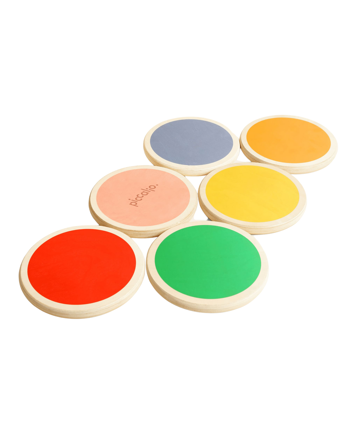 Angled view of Piccalio wooden stepping stones set showing six colorful round stones with non-slip tops on white background