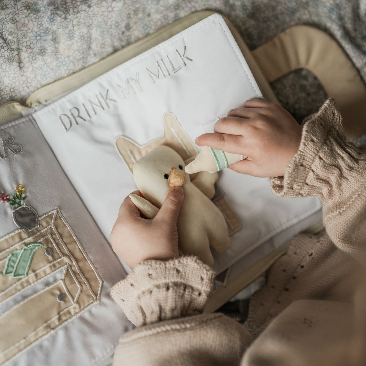 Goodnight Gooseling Activity Book. Girl feeding Gooseling a bottle of milk