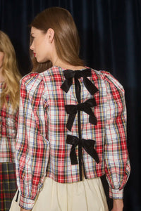 The Lottie Top has a crew neckline, black velvet ribbon ties, balloon sleeves with tailored cuffs.