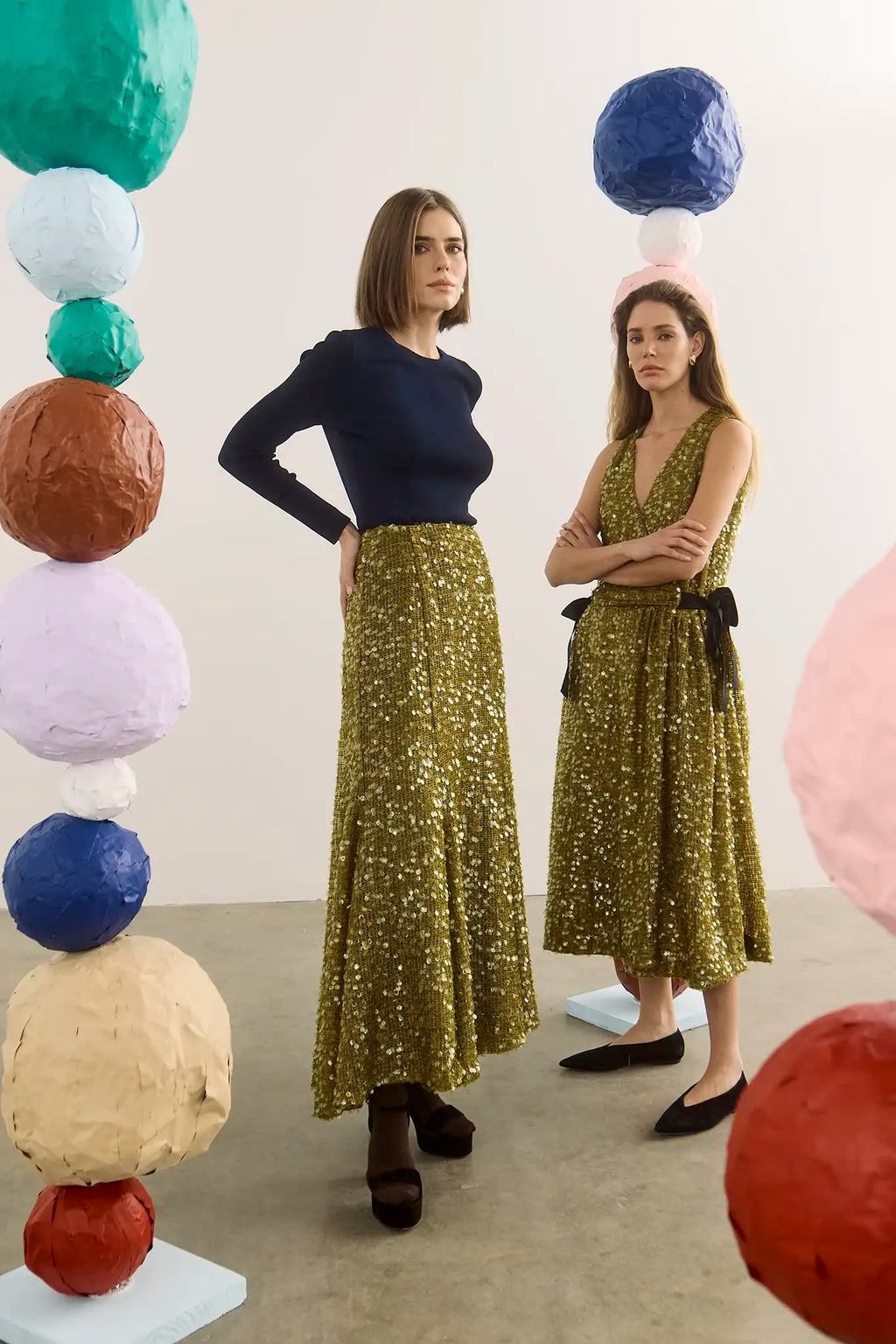 The Callie Sweater in Midnight Blue paired with Lindsey Skirt in Moss Sequin. 