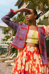 The Coco Jacket is a cropped jacket made with French lurex tweed and finished with Italian cording.