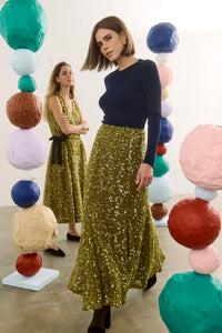 The Callie Sweater in Midnight Blue paired with Lindsey Skirt in Moss Sequin. 