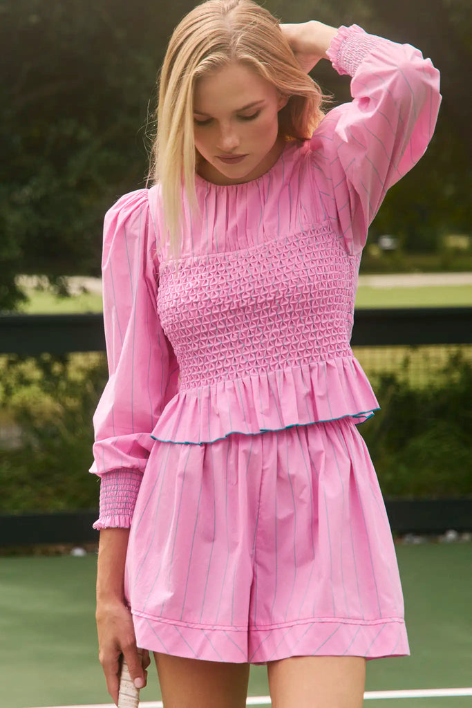 The Eubanks Top in Watermelon Stripe has a fitted bodice, puff sleeves, and smocked cuffs