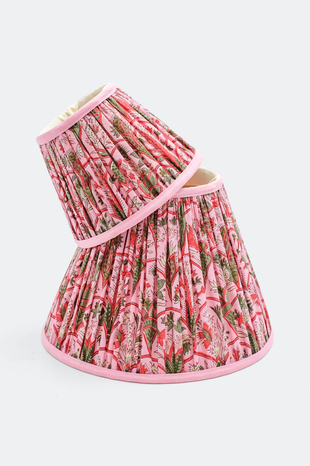 10-inch pleated empire lampshade in pink with Pink Arch blockprint pattern, shown from a side angle