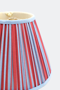 Close-up of 10-inch pleated blockprint empire lampshade featuring red and blue vertical stripes with light blue trim
