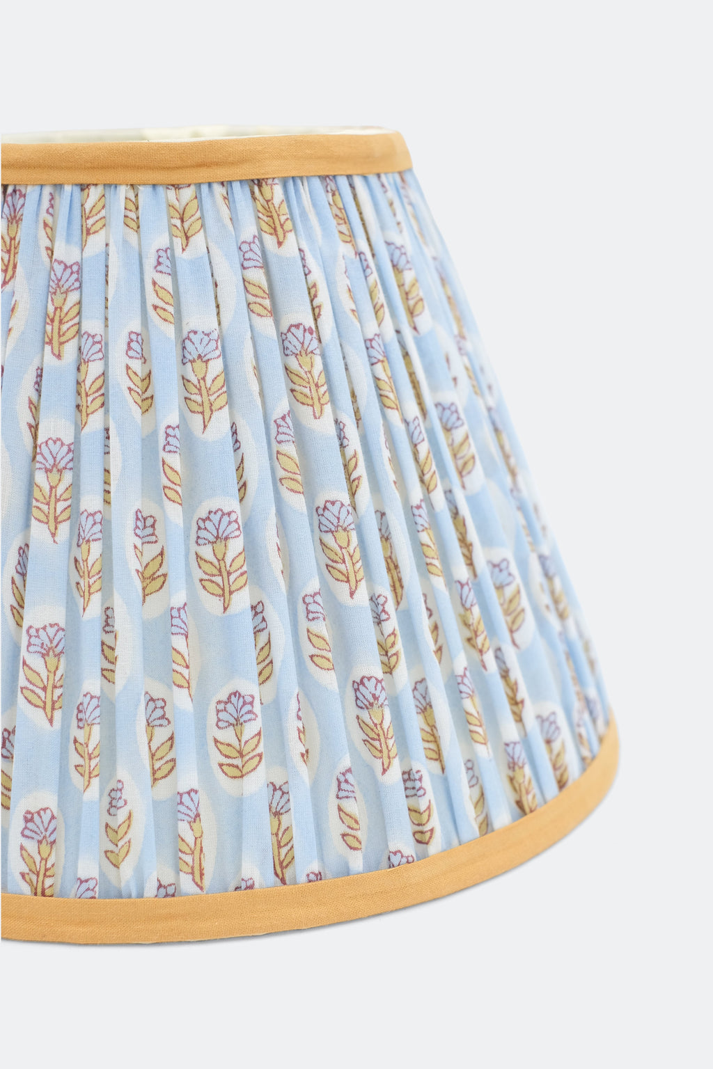 Close-up view of sky blue daisy blockprint pleated empire lampshade