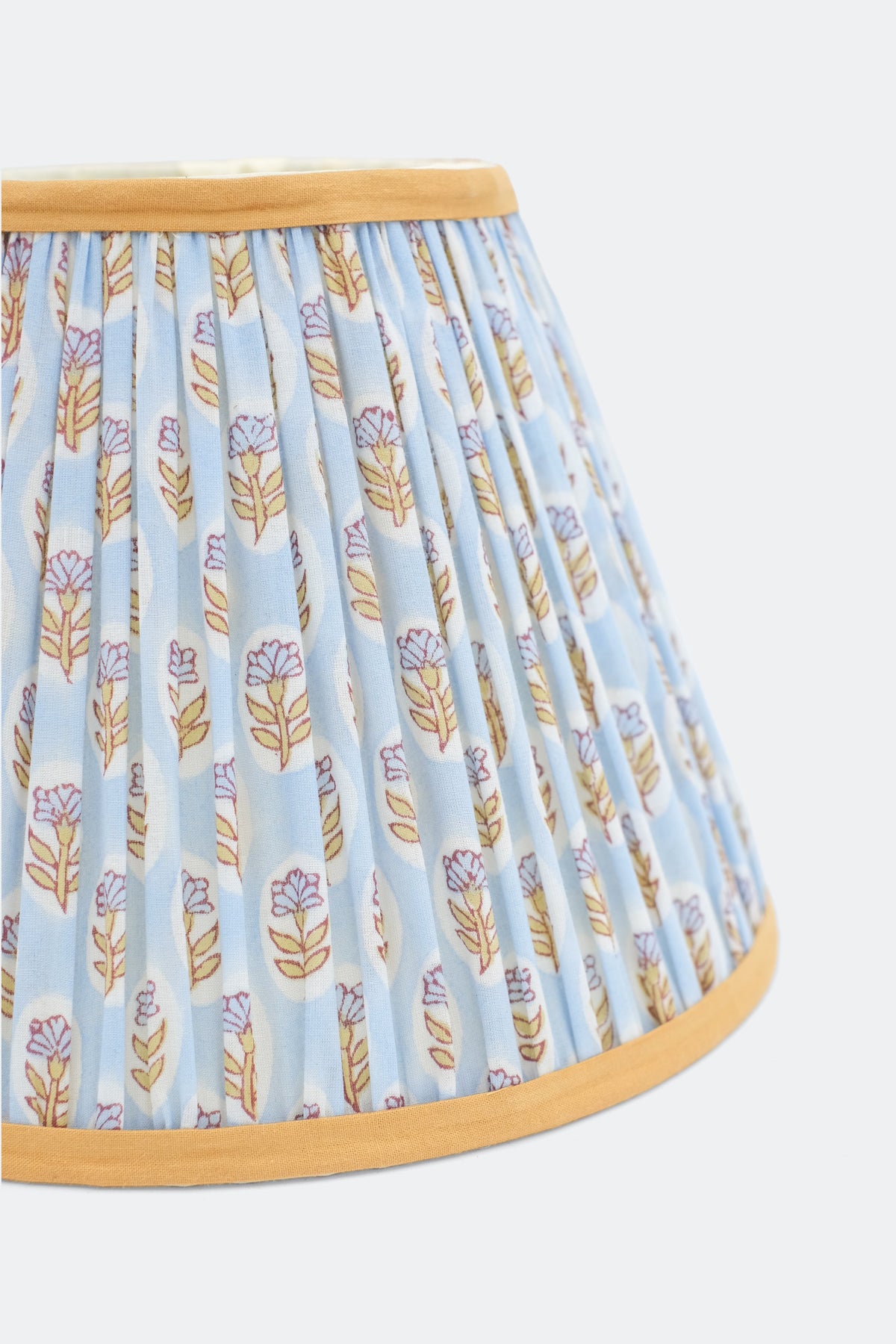 Close-up view of sky blue daisy blockprint pleated empire lampshade