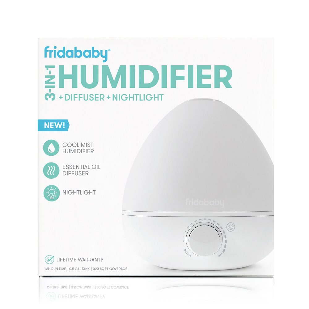 Front of fridababy Breathefrida 3-in-1 humidifier showing dial, features cool mist, diffuser, and nightlight on white background