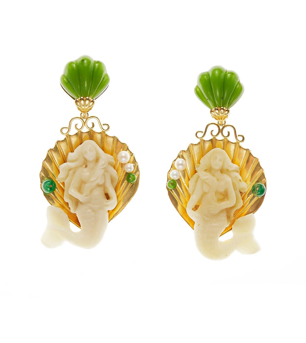 Front view of Mermaid Venus earrings with hand-carved bone mermaid on gold shell, green jade top and pearl and malachite accents on white