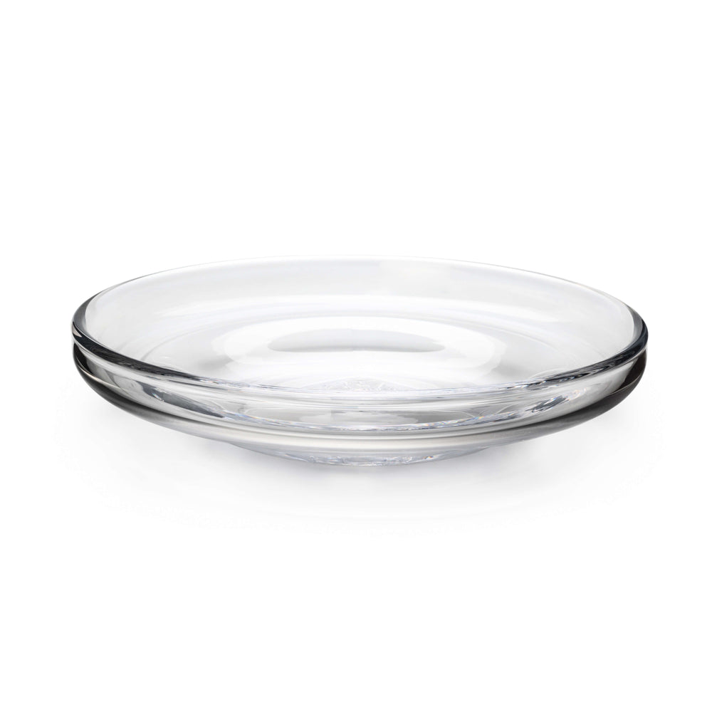 Angled front view of Walden Platter showcasing broad flat surface and low rounded rim in clear mouthblown glass on white background