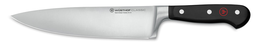 Side view of 8-inch Wüsthof Classic chef’s knife with stainless blade and black triple-riveted handle on white background
