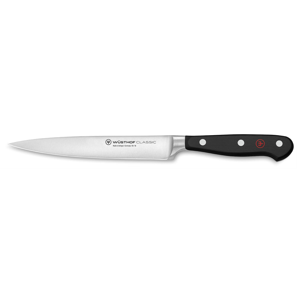Side view of 6-inch Wüsthof Classic utility knife with long stainless-steel blade and triple-riveted black handle on white