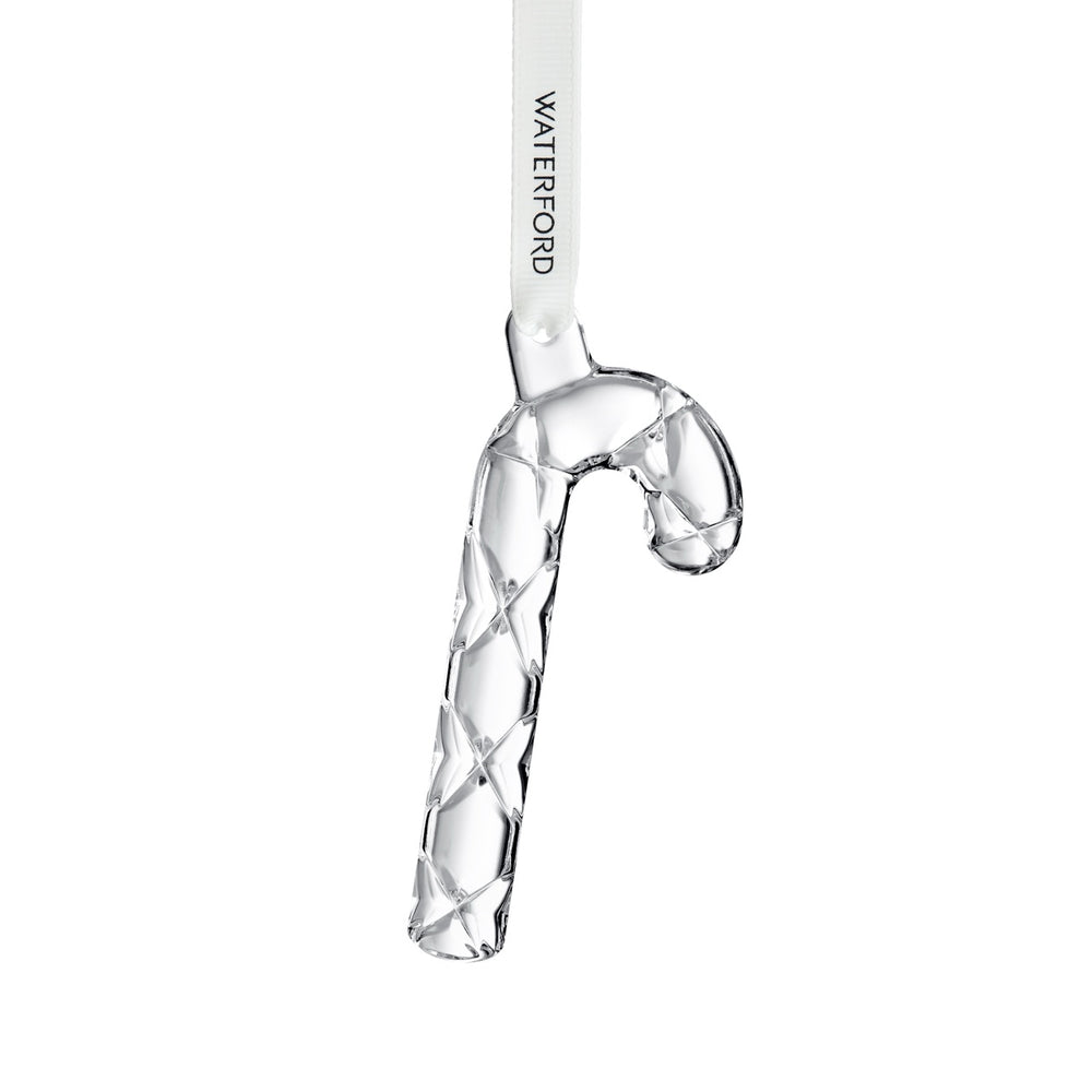 Close-up of mini crystal candy cane ornament showing faceted lattice cut and Waterford-branded white ribbon on white background