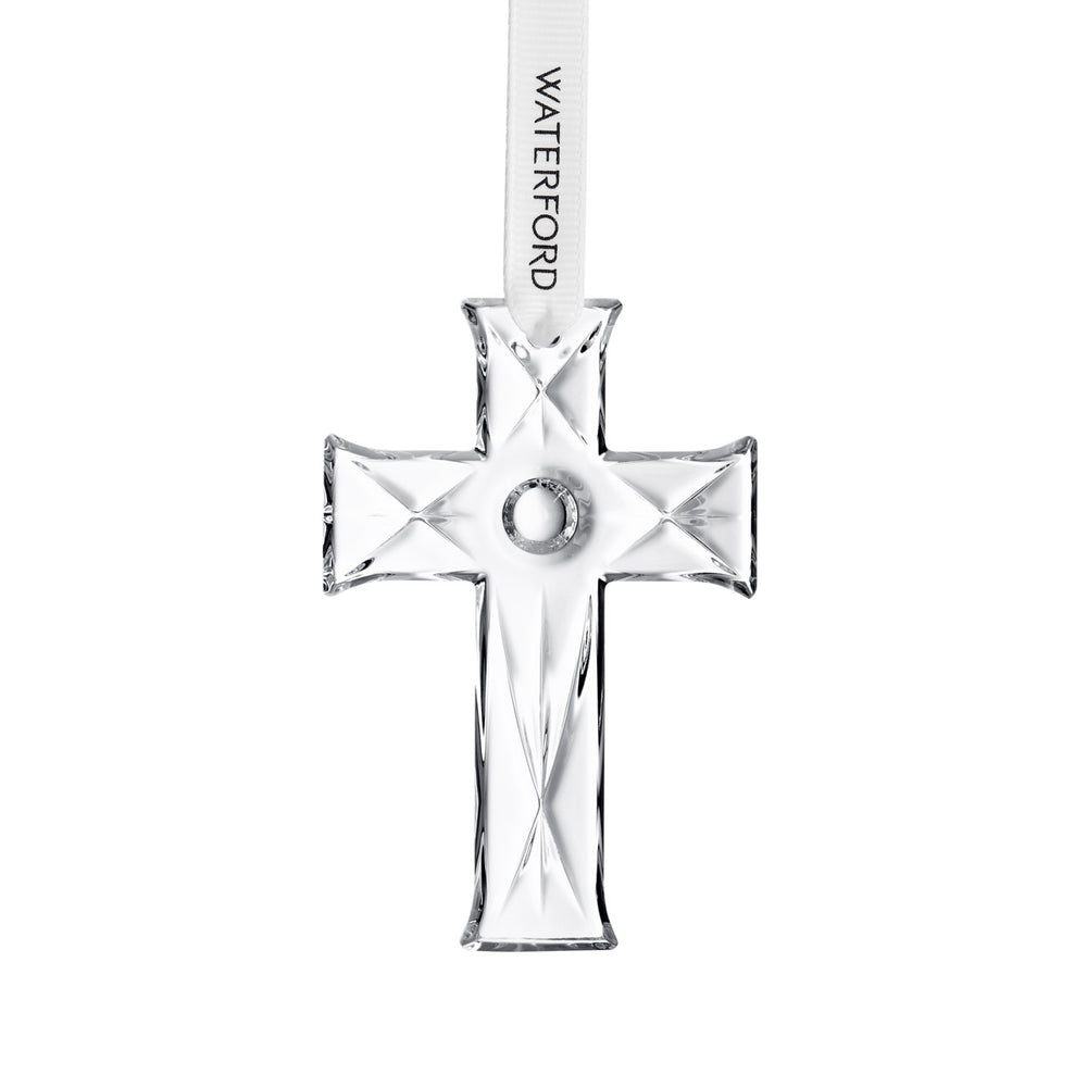 Front view of mini Waterford crystal cross ornament with faceted cuts and Waterford branded white ribbon on white background