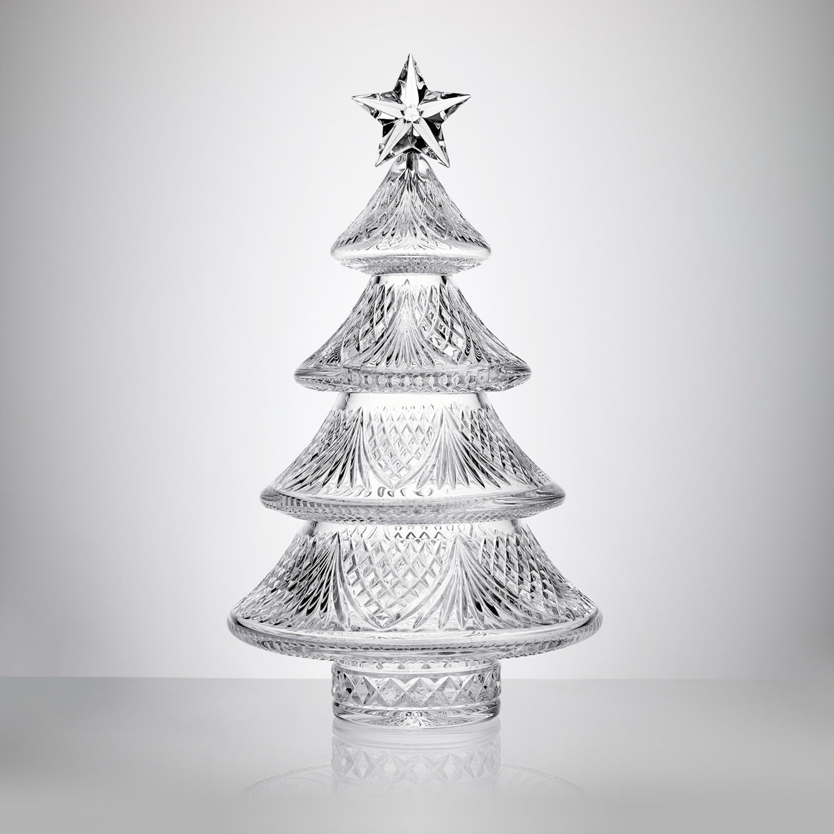 Front view of Sculpted Xmas Tree Medium showcasing four molded tiers, caro patterns, and star on white background