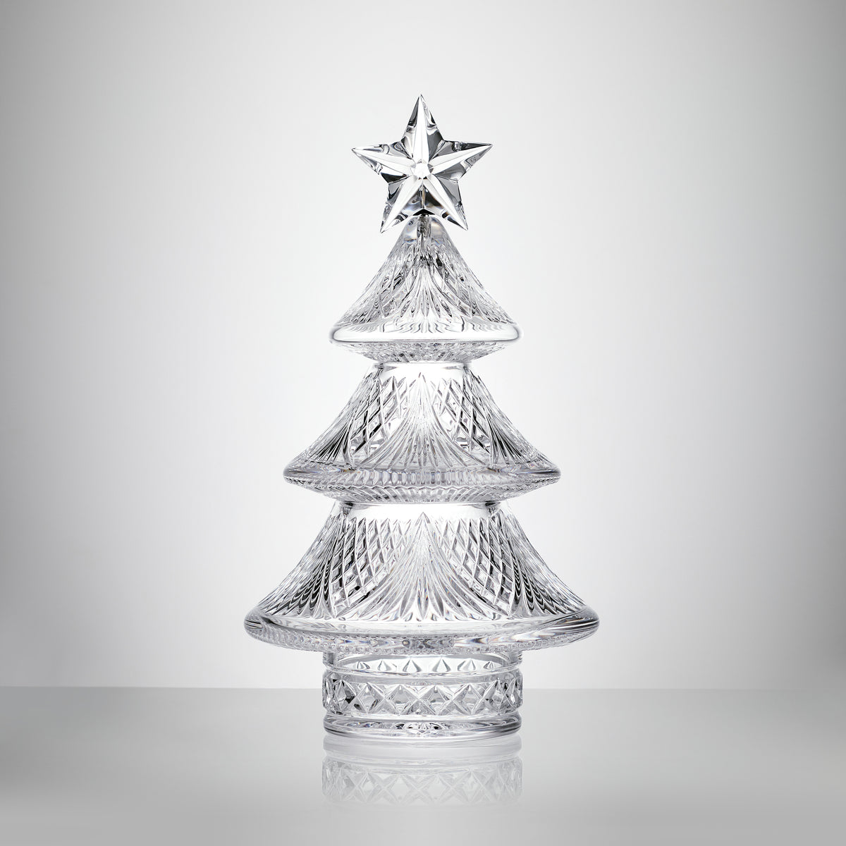 Close-up front view of Sculpted Xmas Tree Small showcasing crystal star topper and cut tiers on a white background