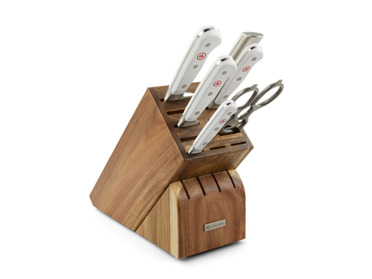 Front three-quarter view of Classic Knife Block Set in White, Set of 7 showcasing white handles and wooden storage block