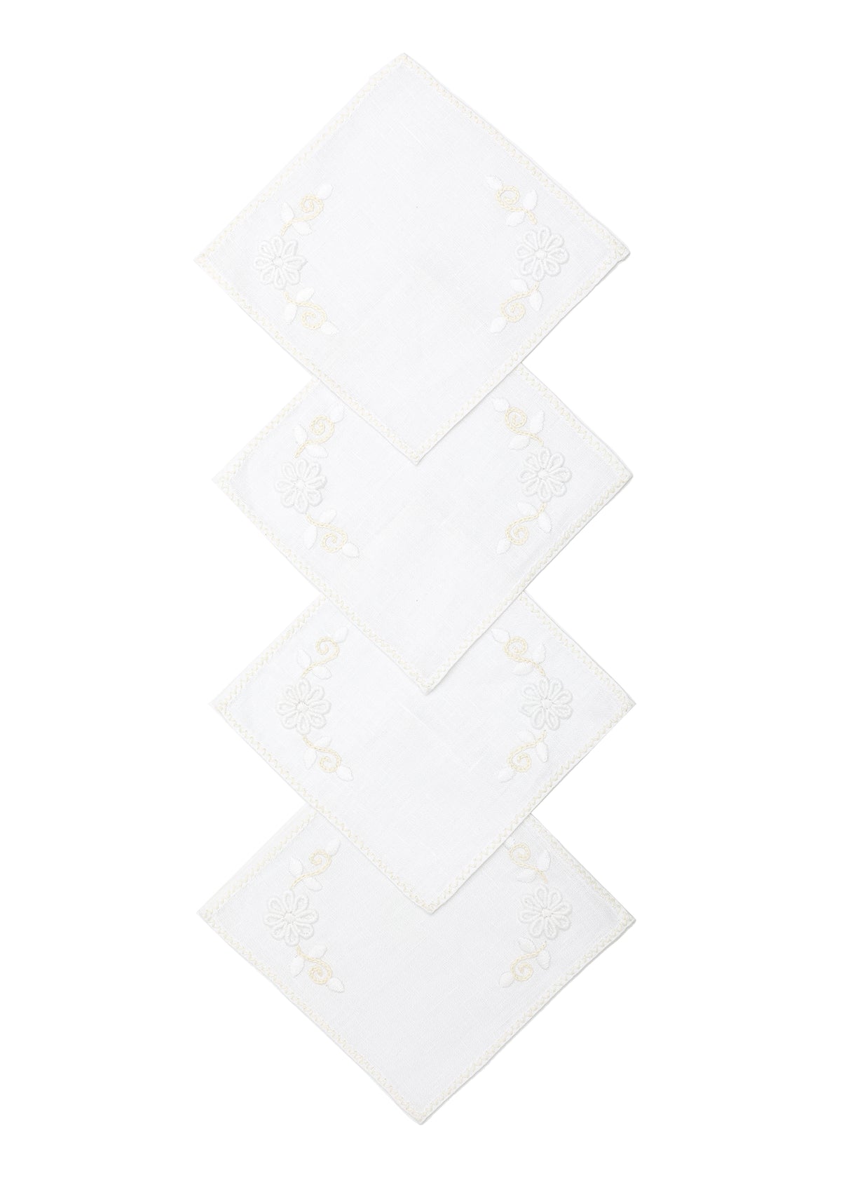 Top view of OTM Exclusive Cocktail Napkins in Bianca, Set of 4 showcasing floral embroidery with a white background