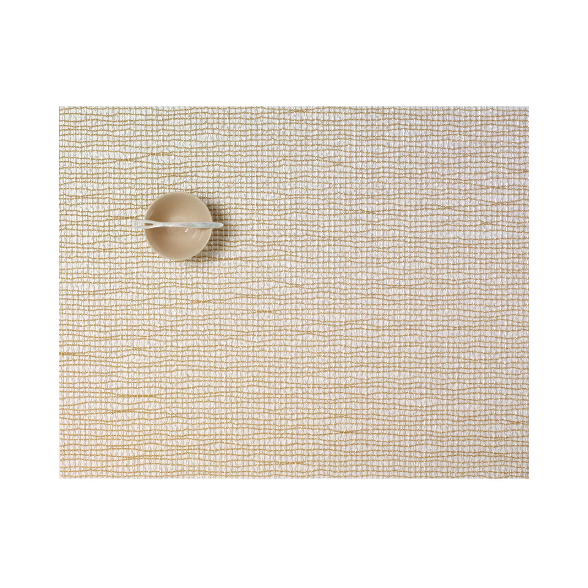 Top view of Lattice placemat in gold showing woven lattice texture with a small beige bowl and spoon on a white background