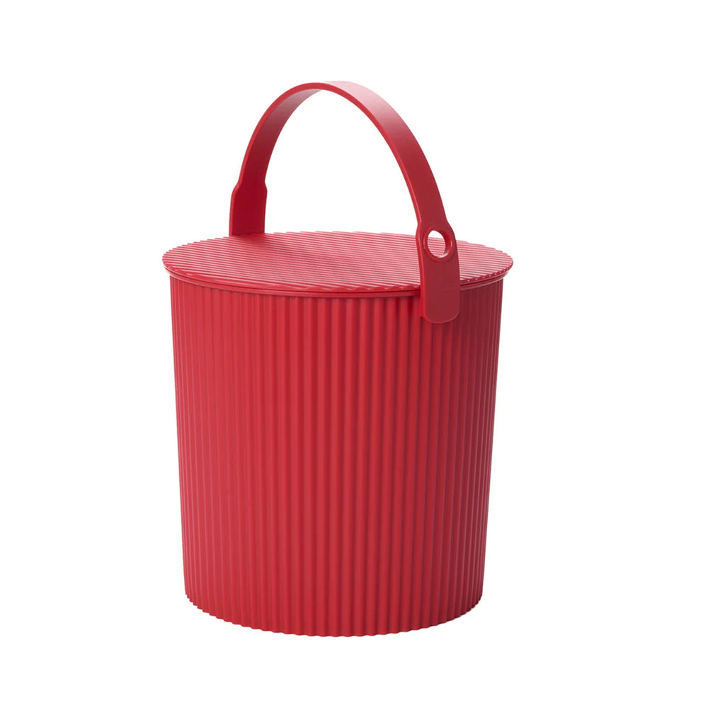 Three quarter view of Hachiman Bucket Large in red showcasing ribbed body, lidded top and carrying handle on white background