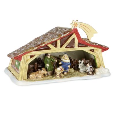 Front view of Christmas Toys Memory Nativity showcasing hand-painted Holy Family beneath a star-topped arch on white background