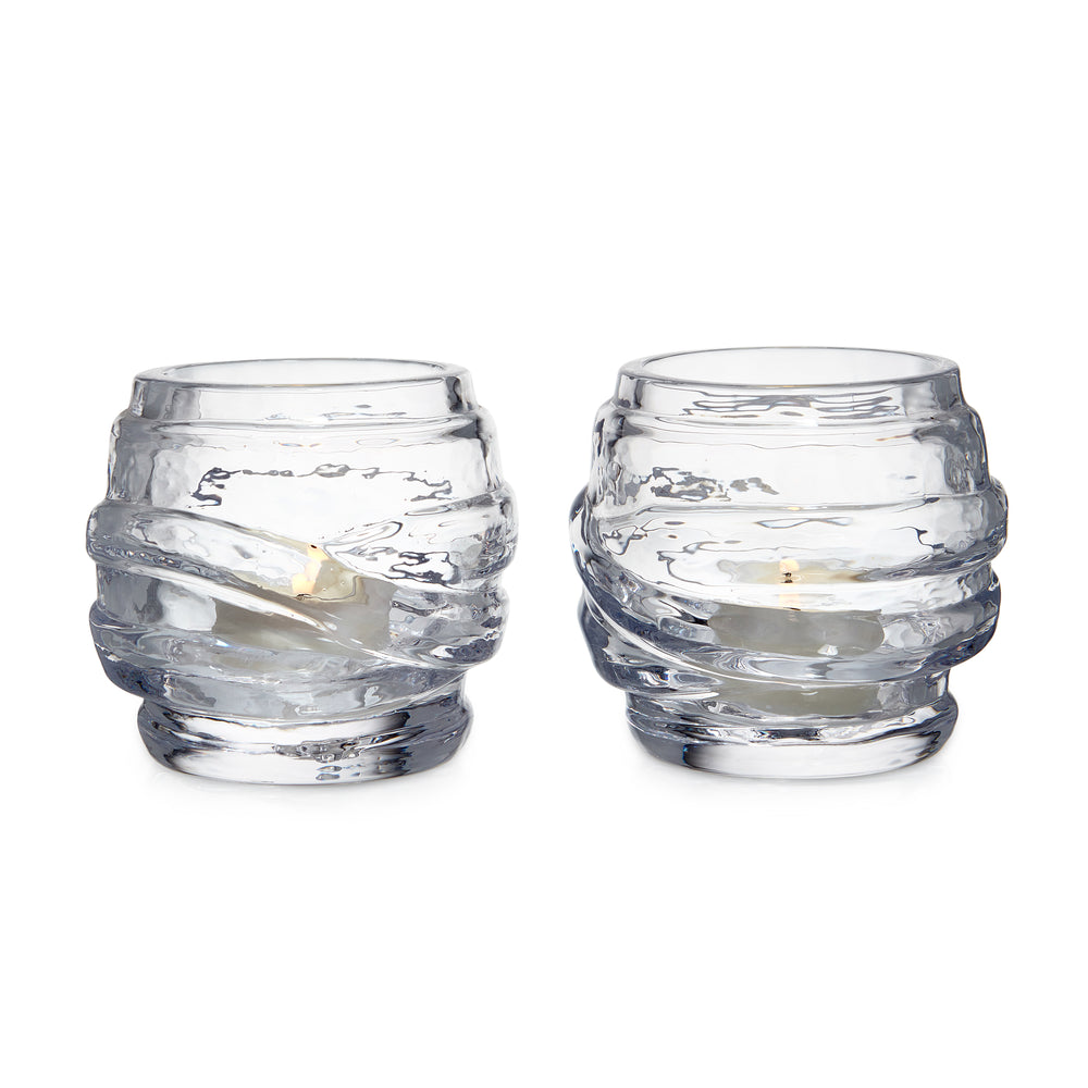 Front view of Waterbury tealight set of two showcasing layered rippled clear glass with lit tealights on white background