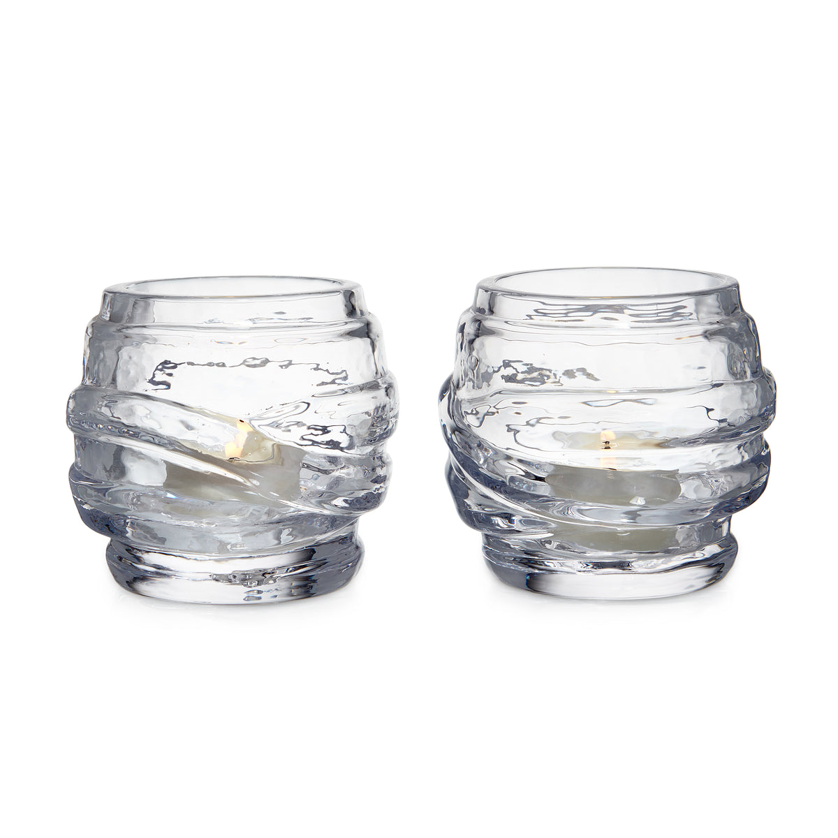 Front view of Waterbury tealight set of two showcasing layered rippled clear glass with lit tealights on white background
