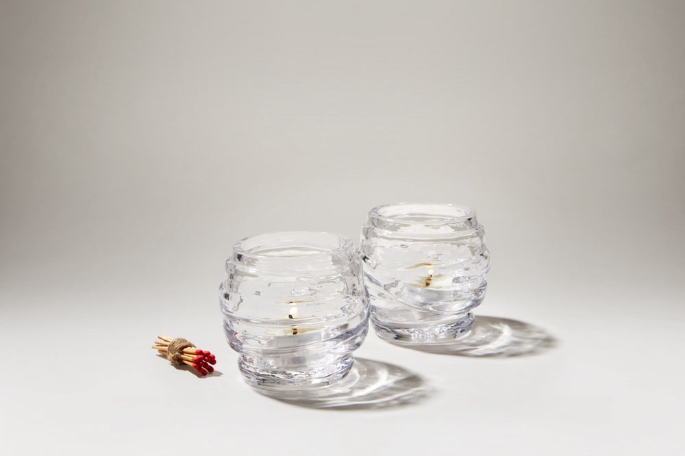 Three quarter view of Waterbury tealight set showcasing layered optic clear glass on white background