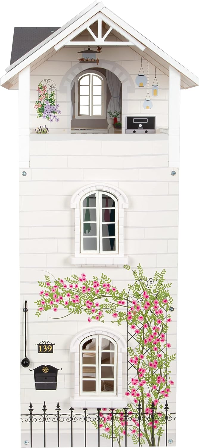 Front view of Iconic Urban Villa dollhouse playset showing three-story white façade with arched windows, balcony, and pink climbing roses