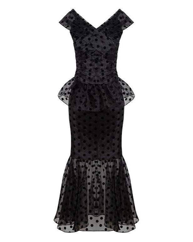 Front of Lily top and skirt set, black polka dot; pleated V-neck top with peplum and fitted mermaid skirt on white background