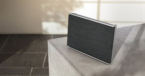 Beosound Level Portable Home Speaker in Natural Aluminum/Dark Gray