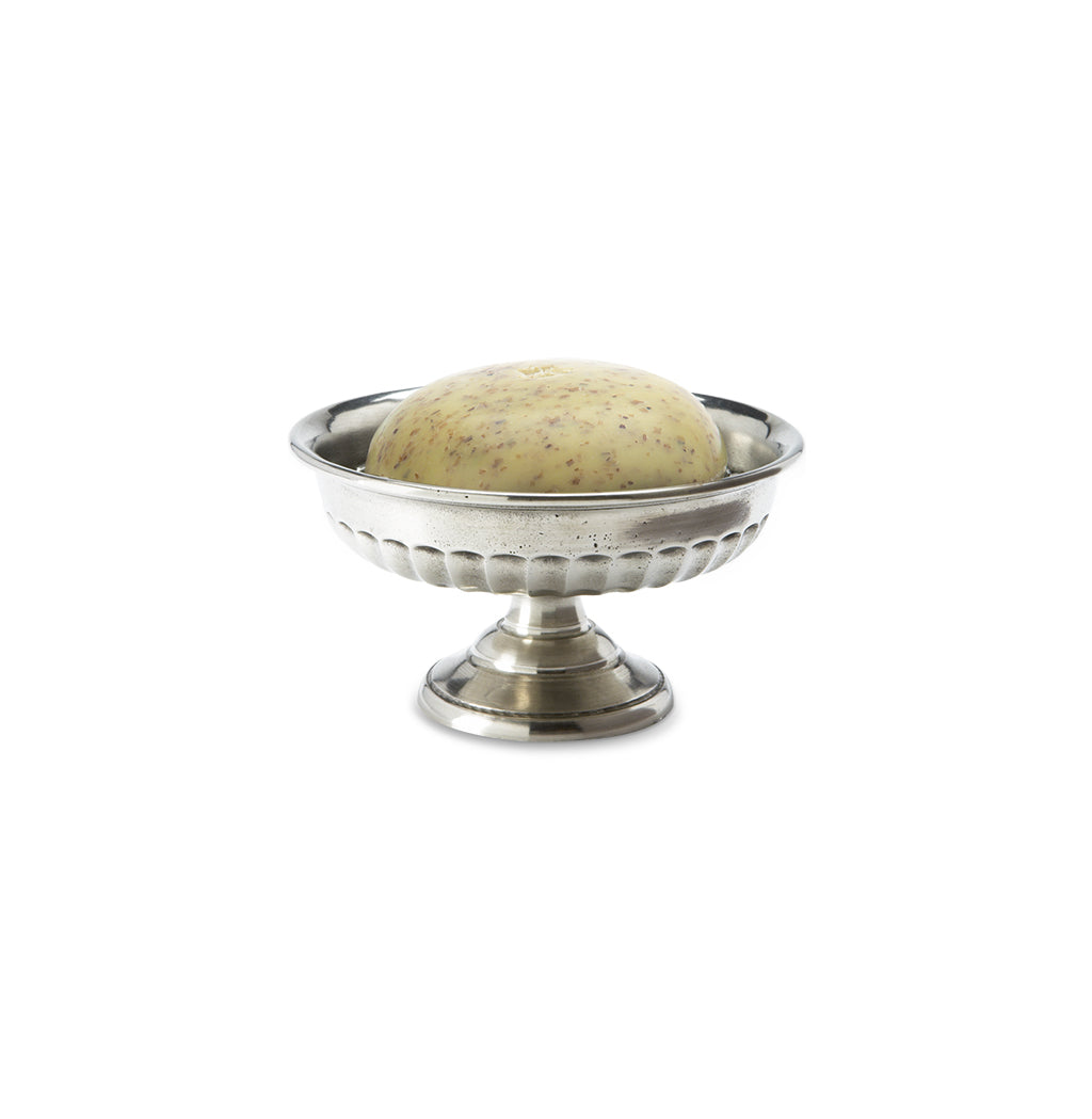 Front view of Impero Soap Dish showcasing raised pedestal and scalloped rim with soap bar on white background