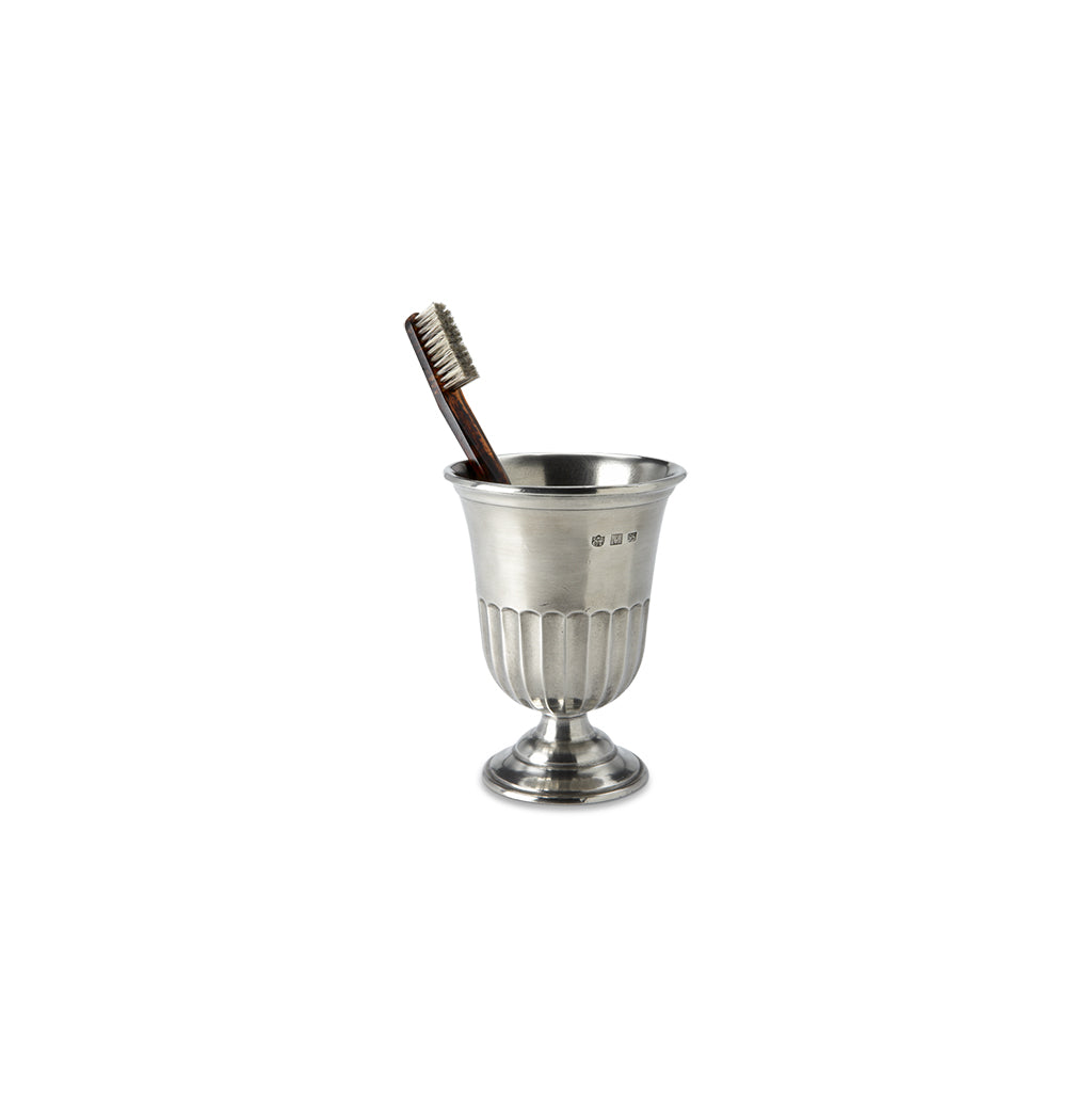 Front view of Impero Toothbrush Cup showcasing classic fluting, pedestal base, and toothbrush with a white background