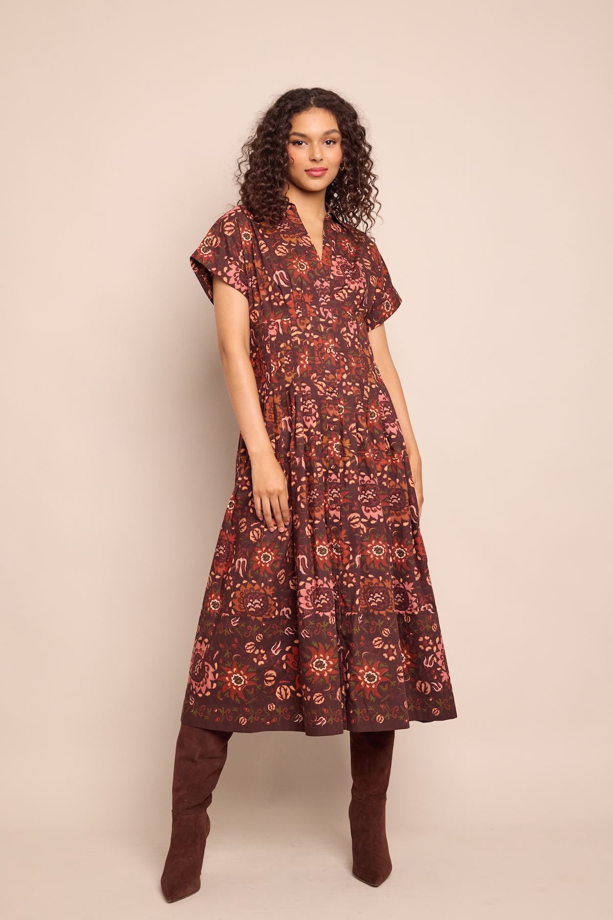 Front view of Nash Midi Dress in Batik Vine Wine showcasing fit-and-flare silhouette and placed print against beige backdrop