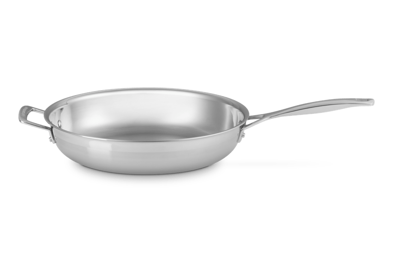 Angled view of 12-inch Classic stainless steel frying pan with satin-matte exterior, polished interior, and long handle on white background