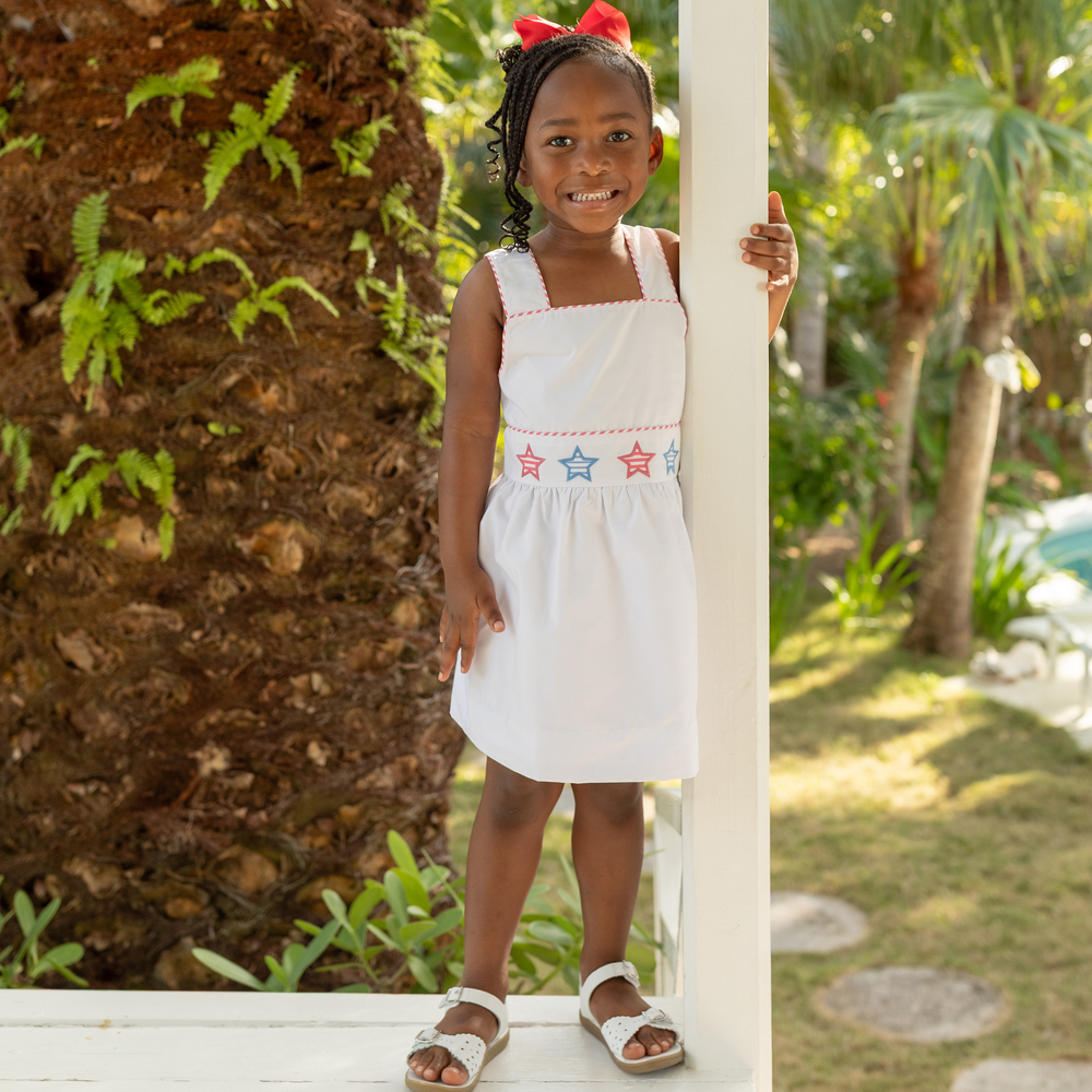 Henry Duvall Campbell girls white dress with red and blue star appliqué and ric rac trim, classic patriotic dress for Memorial Day, 4th of July, and summer occasions