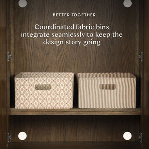 Interior view of Astre Assembled Armoire in Toffee with two coordinated fabric bins and Better Together design story