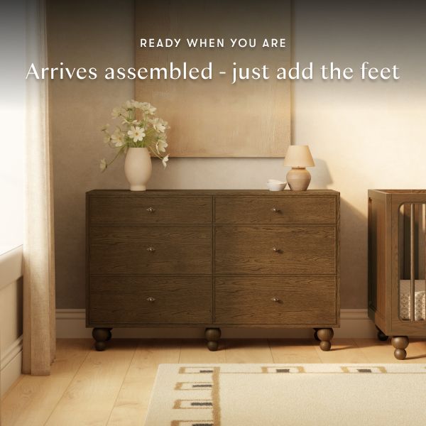 Front view of Toffee Astre 6 drawer dresser by Nate Berkus with feet in a styled room, arrives assembled, just add feet