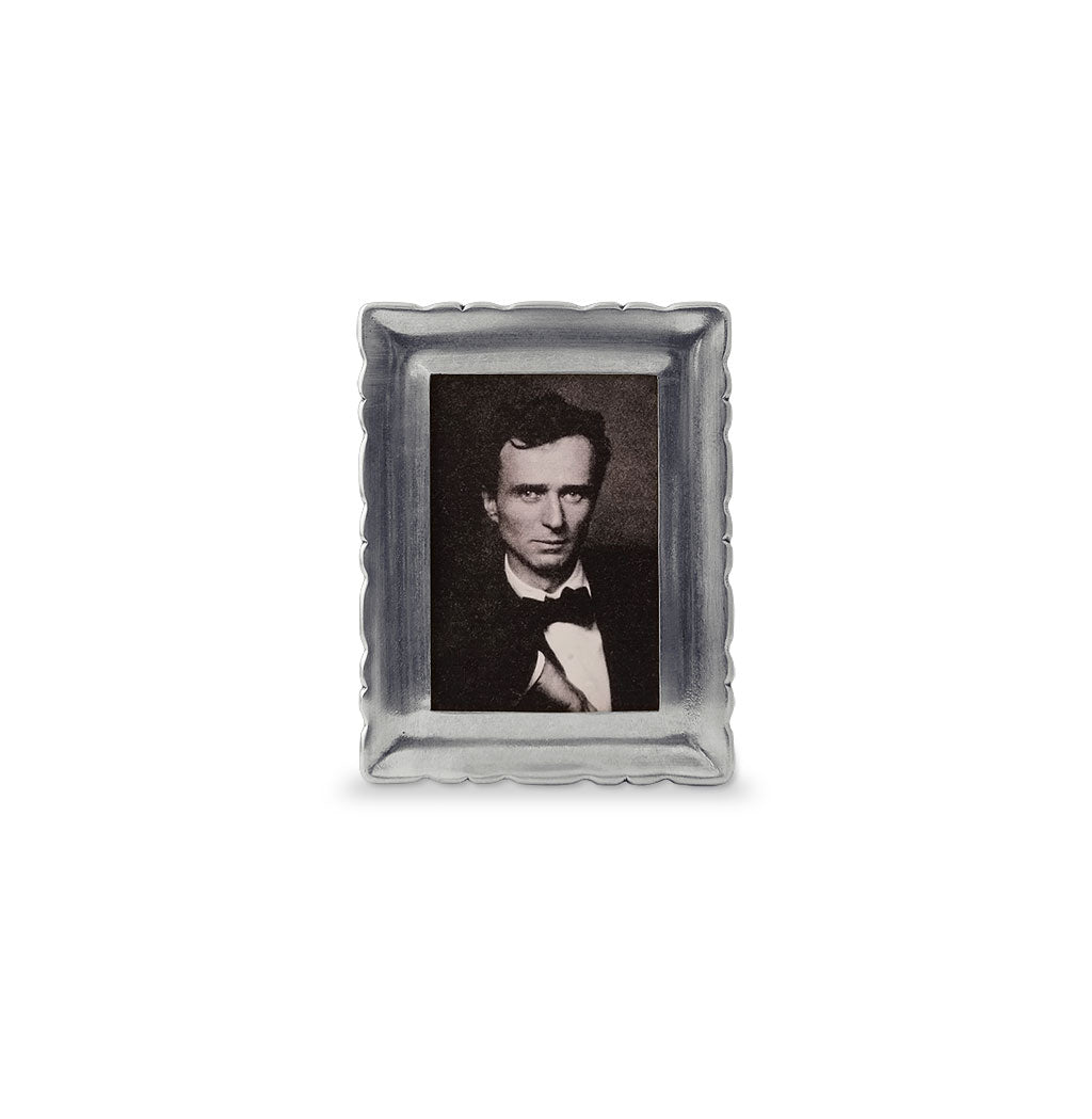 Front view of Small Carretti pewter rectangle frame showcasing scalloped decorative border and 4 by 6 inch opening on white background