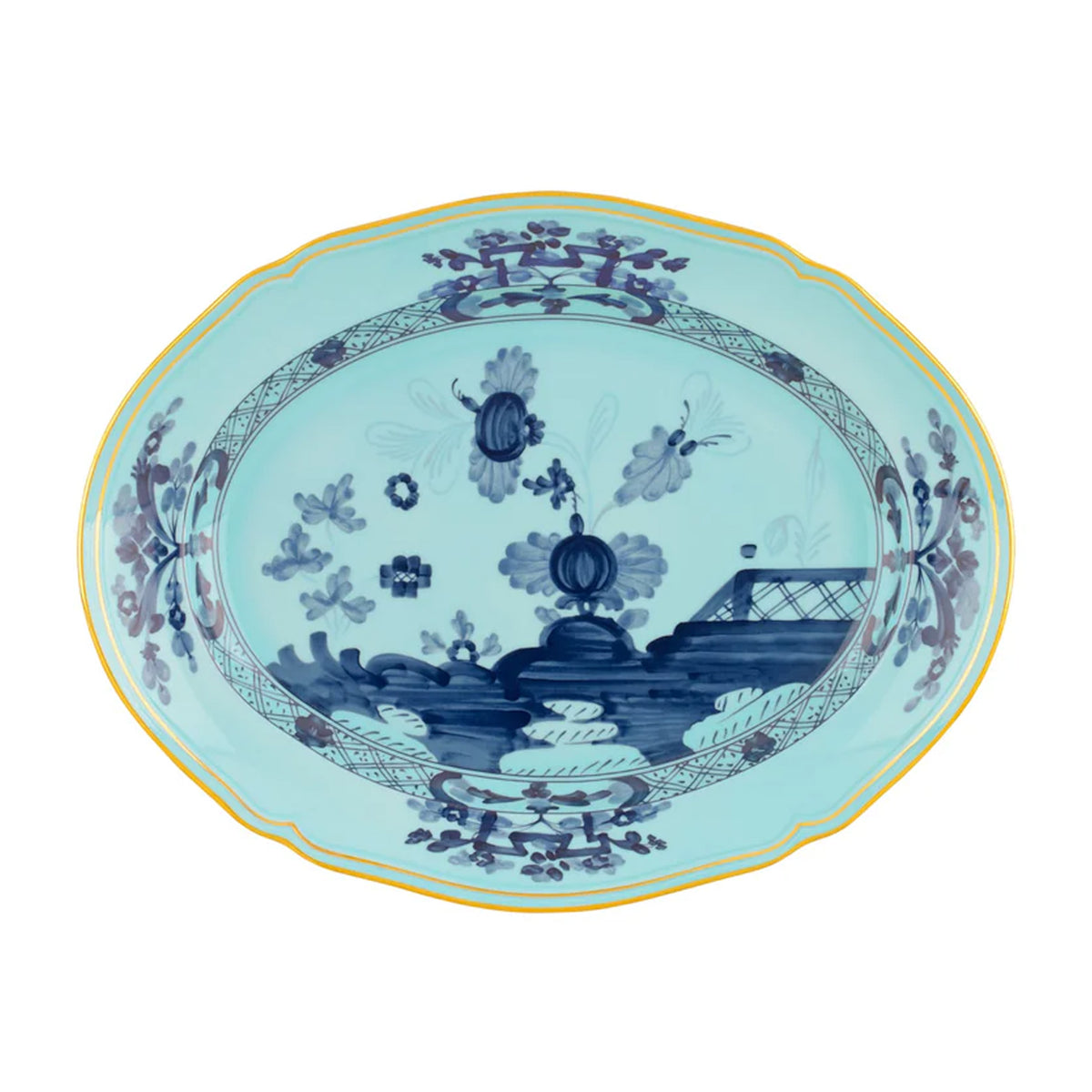 Top view of Oriente Italiano oval platter showcasing hand-painted blue floral motif and gold rim on white background