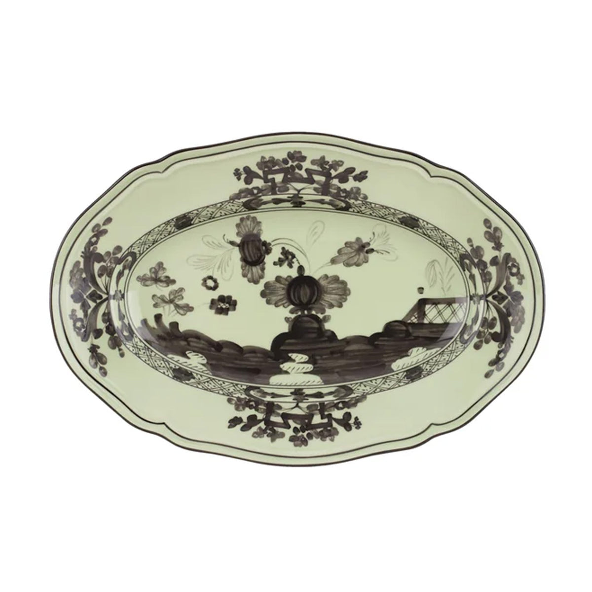 Top view of Oriente Italiano oval platter showcasing pale green porcelain with dark brown floral and scenic pattern